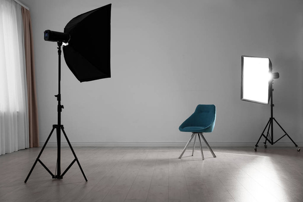 Photo studio interior with set of professional equipment - Fotó, kép