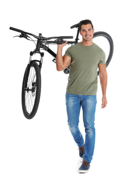 Handsome young man with modern bicycle on white background - Fotografie, Obrázek