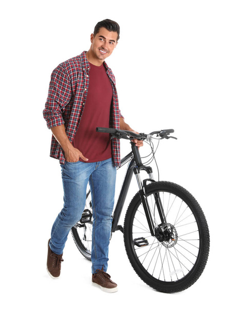 Handsome young man with modern bicycle on white background - Foto, afbeelding
