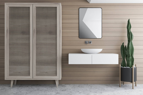 Wooden bathroom with sink and wardrobe - Фото, изображение