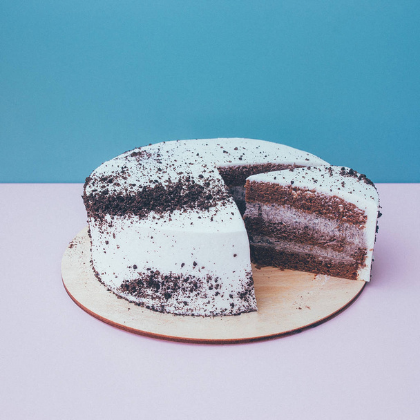 a cut of cake with whipped cream on the table background. - Fotoğraf, Görsel