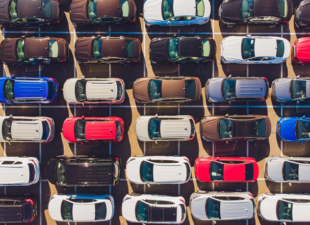 Top view of new cars lined up outside an automobile factory for import export. - Foto, immagini