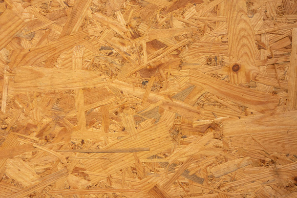 Drewniana Płyta wiórowa. Panel wykonany z wiórów drzewnych. Twórczy Vintage ciemny - Zdjęcie, obraz