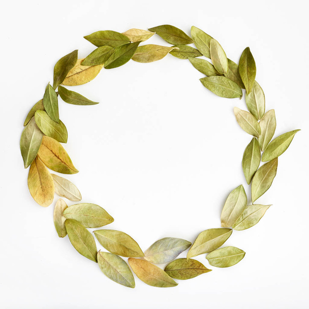 Autumn composition. Wreath made of autumn leaves . Flat lay, top view, copy space, square - Photo, Image