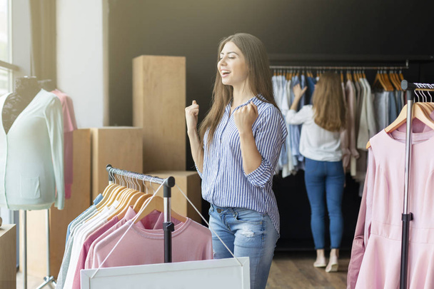 Young woman happy to find items she wants - Photo, Image