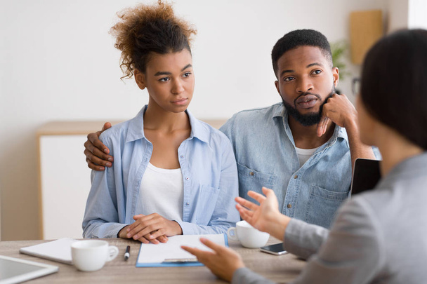 Serious Black Couple Listening To Financial Advisor During Investment Consultation - Photo, Image