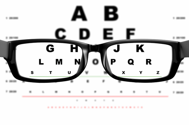 View through glasses on the background of the board for eye examination - Foto, imagen