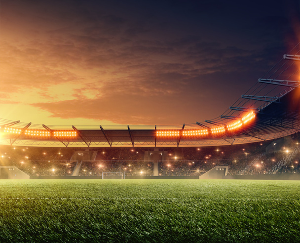 Estadio de fútbol con tribunas y cielo nocturno dramático. Deportes iluminado arena
 - Foto, imagen
