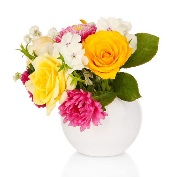 Beautiful bouquet of bright flowers in glass vase, isolated on white - Fotó, kép