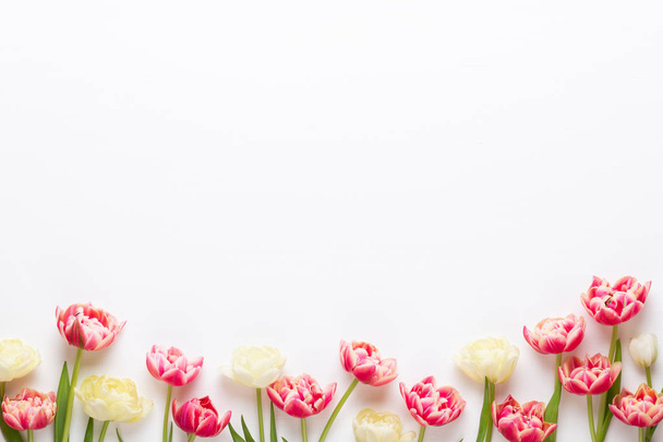 Spring flowers tulips on pastel colors background. Retro vintage - Photo, Image