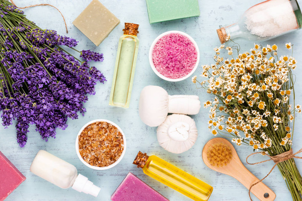 Grooming products and fresh lavender bouquet on white wooden tab - 写真・画像
