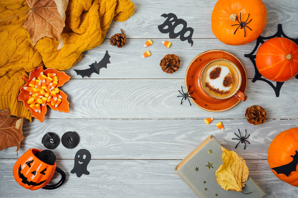 Halloween holiday background with coffee cup, pumpkin and autumn - Photo, Image