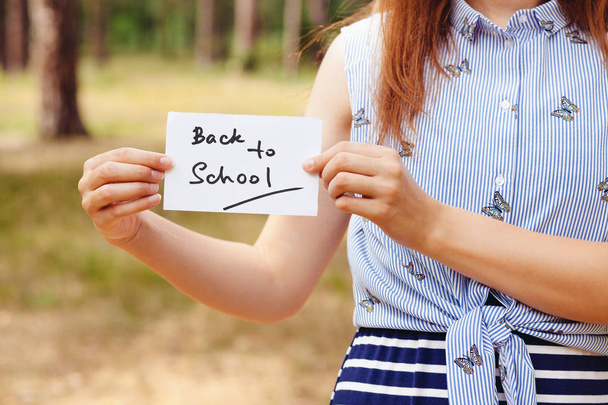 Girl with card - Back to school lettering, education concept - Foto, Imagem