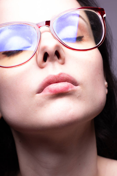beautiful girl with glasses portrait studio - Фото, изображение