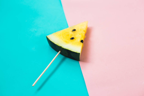 triangular ice cream slices on a stick of ripe yellow watermelon - Photo, Image