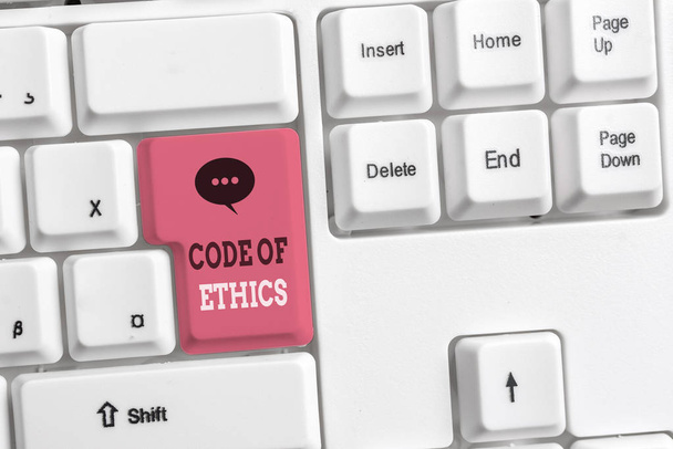 Text sign showing Code Of Ethics. Conceptual photo basic guide for professional conduct and imposes duties White pc keyboard with empty note paper above white background key copy space. - Photo, Image
