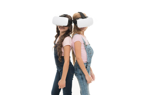 Taking advantage of this new technology. Adorable little kids using VR technology for learning and playing. Cute small children experiencing innovative technology. The technology is there, copy space - Photo, image
