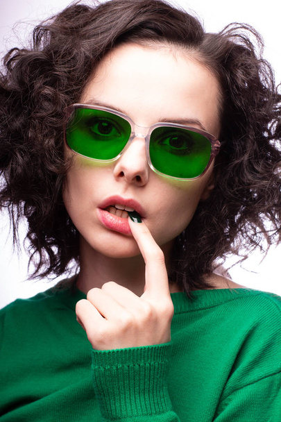 beautiful girl in green glasses and green sweater - Zdjęcie, obraz