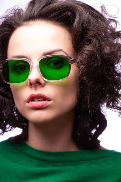 beautiful girl in green glasses and green sweater - Zdjęcie, obraz