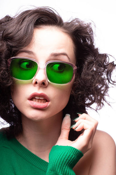 beautiful girl in green glasses and green sweater - Photo, image