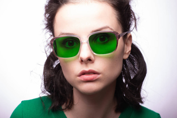 beautiful girl in green glasses and green sweater - Fotografie, Obrázek