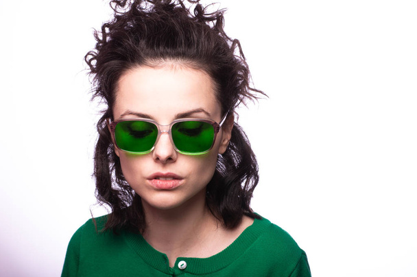 beautiful girl in green glasses and green sweater - Foto, afbeelding