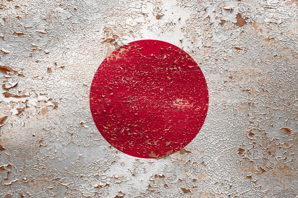 National flag of Japan  on old peeling wall background.The concept of national pride and symbol of the country. - Photo, Image