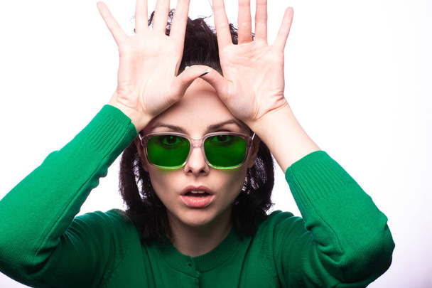 beautiful girl in green glasses and green sweater - Foto, Bild