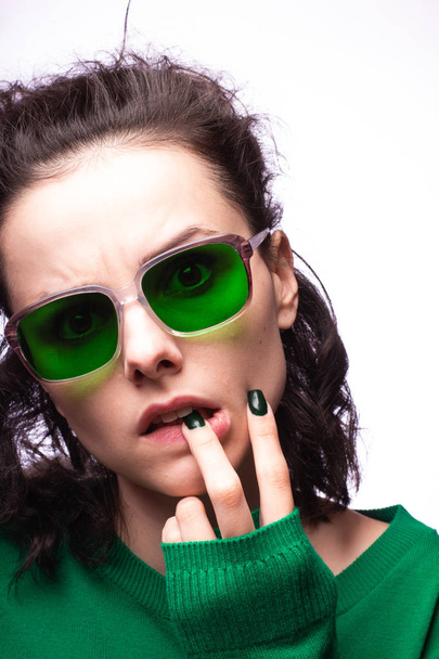 beautiful girl in green glasses and green sweater - Photo, Image