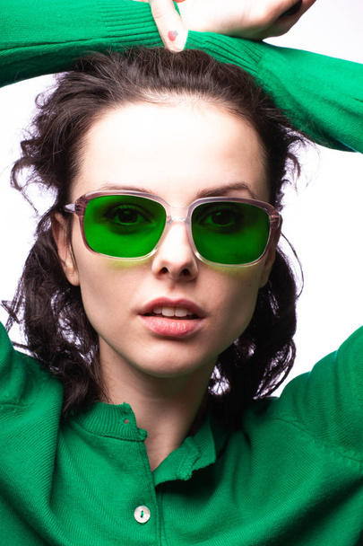 beautiful girl in green glasses and green sweater - Foto, Bild