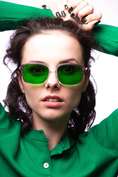 beautiful girl in green glasses and green sweater - Foto, Imagen