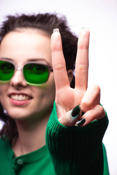 beautiful girl in green glasses and green sweater - Фото, зображення