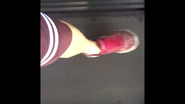 Close-up. Man sneakers run on a treadmill. - Footage, Video