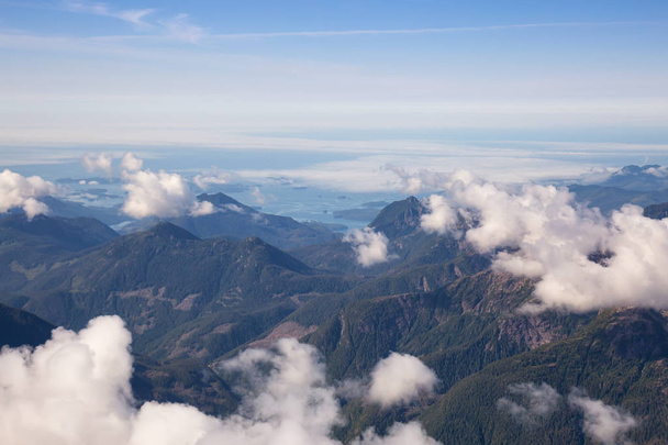 Aerial Landscape View of Beautiful Coastal Mountains on the Pacific Ocean Coast during a sunny summer morning. Taken near Tofino and Ucluelet, Vancouver Island, British Columbia, Canada. - Valokuva, kuva