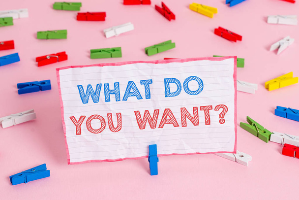 Text sign showing What Do You Want Question. Conceptual photo say or write in order to ask demonstrating about something Colored clothespin papers empty reminder pink floor background office pin. - Photo, Image
