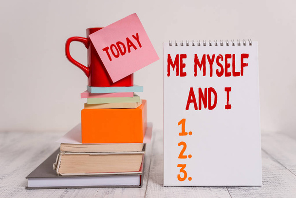 Word writing text Me Myself And I. Business concept for used by speaker to refer to herself as the object of a verb Cup sticky note stacked note pads books square box spiral wooden table. - Photo, Image