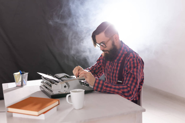 People and technology concept - High angle view of bearded writer - Photo, Image