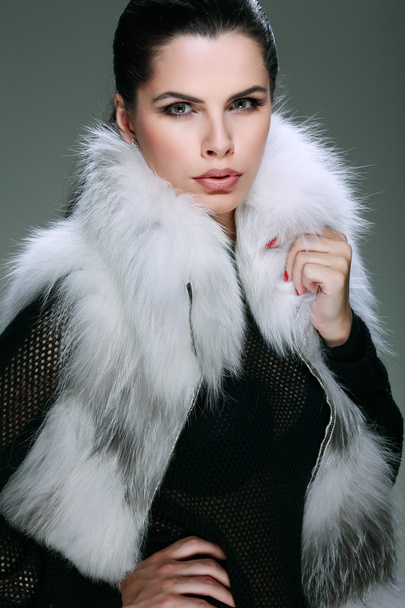 A photo of sexual beautiful girl is in fashion style is in fur clothes - Фото, зображення