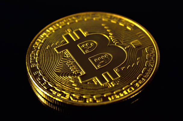 Gold coin, bitcoin cryptocurrency on a dark background. - Zdjęcie, obraz