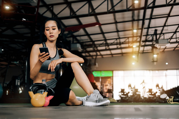 sport woman at fitness gym club sitting relaxing after exercise  - Photo, image