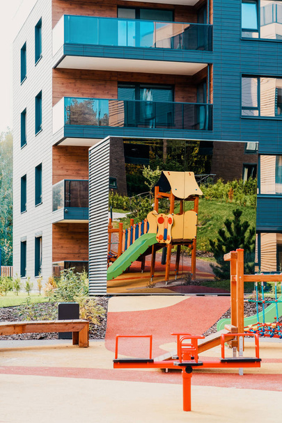 Children playground at European modern residential building quarter - Fotó, kép