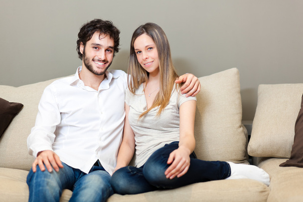 Happy couple on the sofa - Zdjęcie, obraz