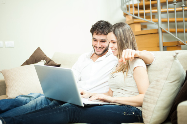 Couple using a notebook - Photo, image