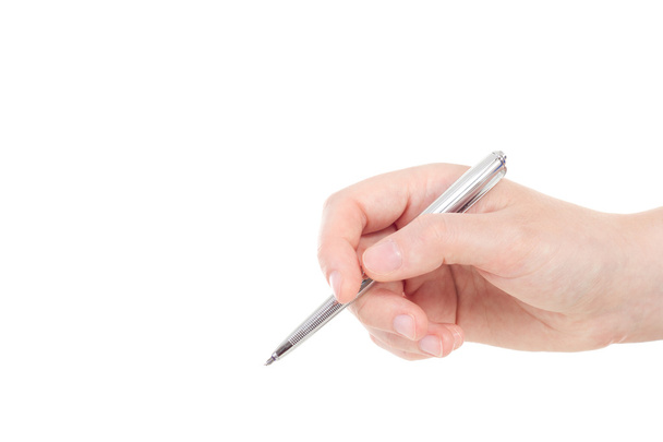Mão branca com caneta de cor prata
 - Foto, Imagem