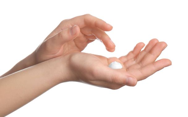 Woman applying cream onto hands isolated on white, closeup - Foto, Bild