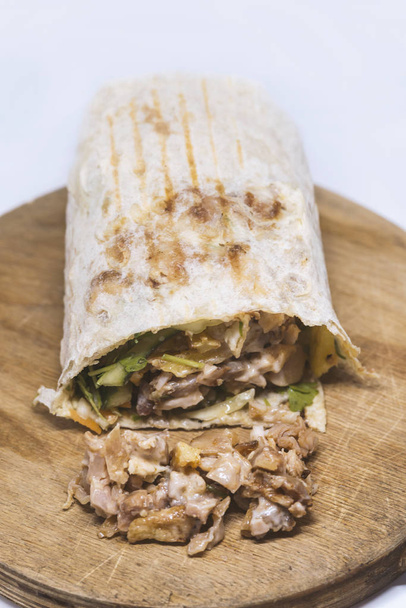 shawarma sandwich,doner kebab,gyro on a wooden table - 写真・画像