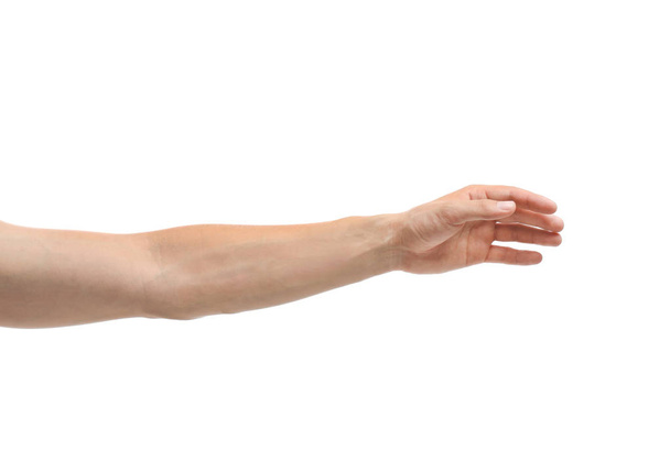Young man held out hand on white background, closeup - Foto, Bild