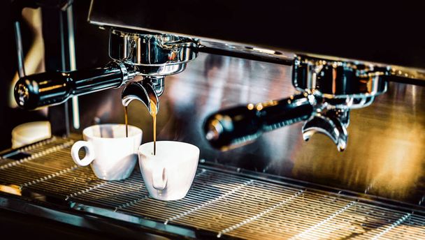 Espresso machine brewing a coffee. Coffee pouring into glasses i - Zdjęcie, obraz