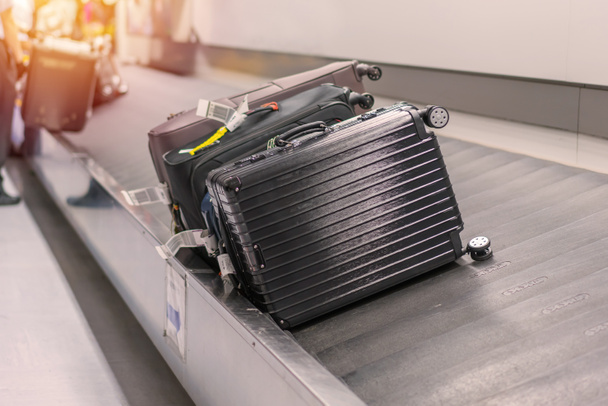 Suitcase or luggage with conveyor belt in the airport - Photo, image