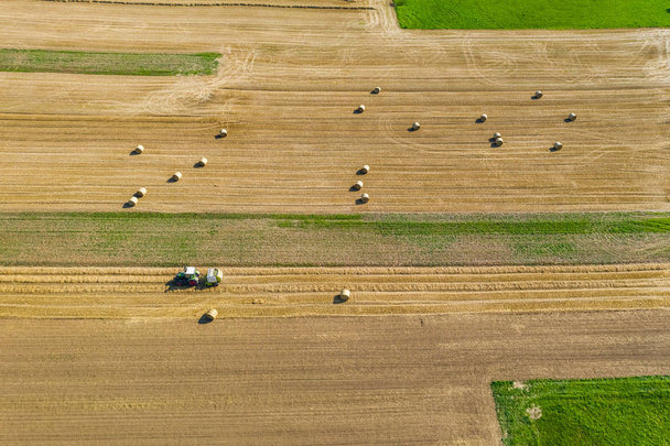 farm work on a field from above - Photo, image